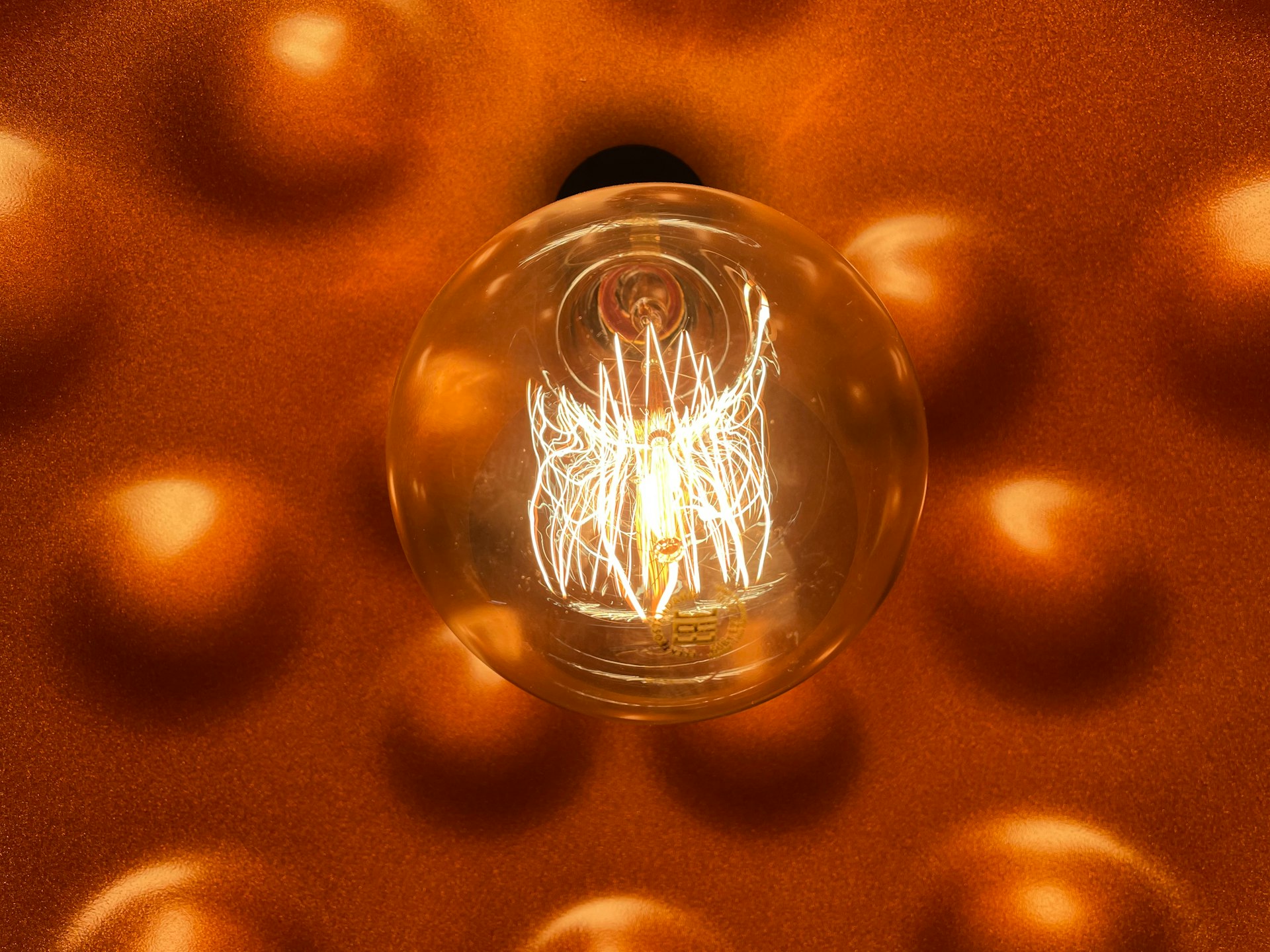 a light bulb hanging from a ceiling in a room